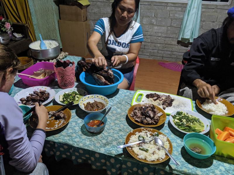 During the family meal, a woman cuts meat from a wild boar’s head caught that morning in a Lundayeh village. Lundayeh are traditionally Christian as is most of interior Borneo, unless they are Animist, hence the pork. “One of the best meals I’ve ever had, for sure,” Kammerer said.